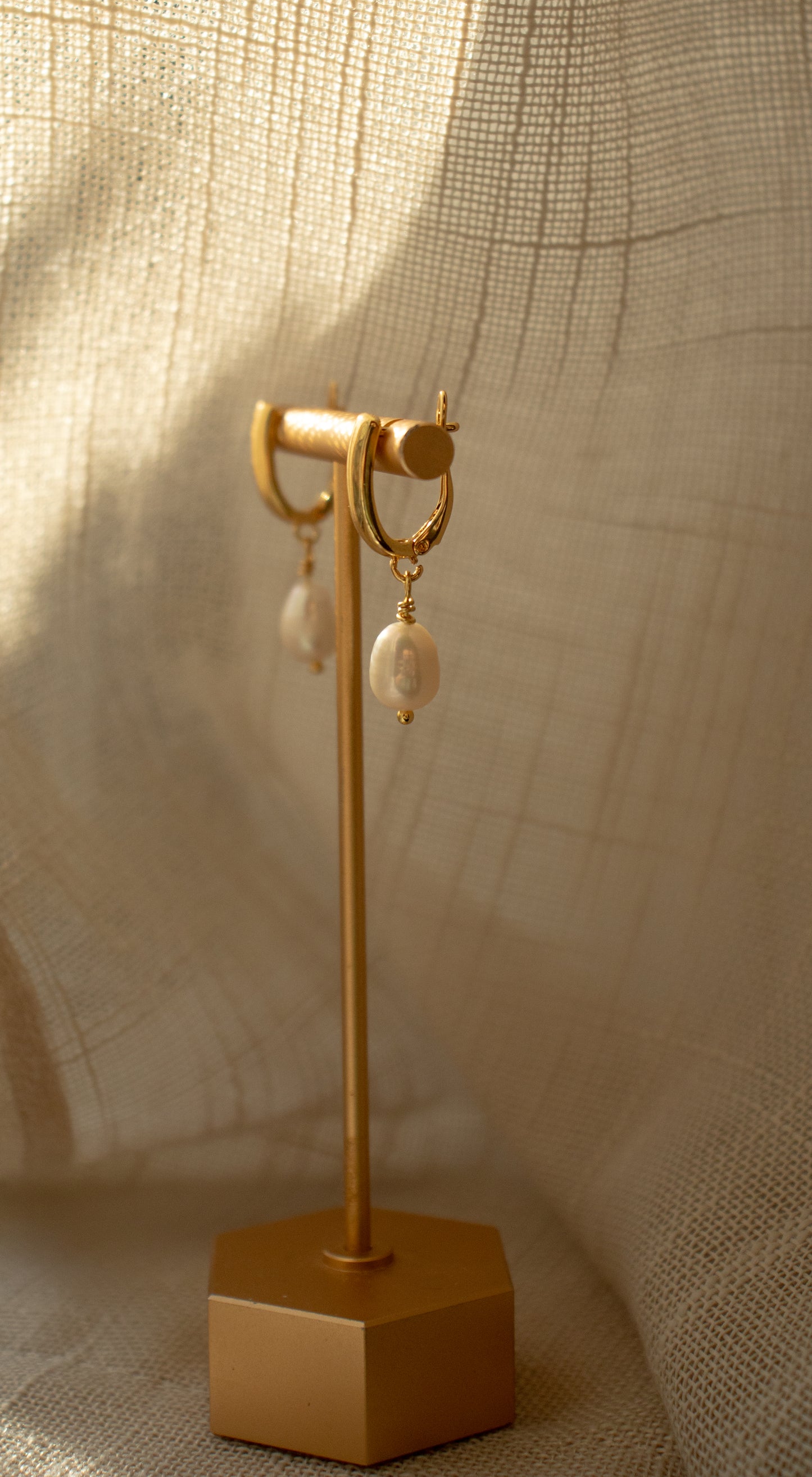 
                  
                    Chunky Huggie Hoop Pearl Drop Earrings by Majo Collections
                  
                